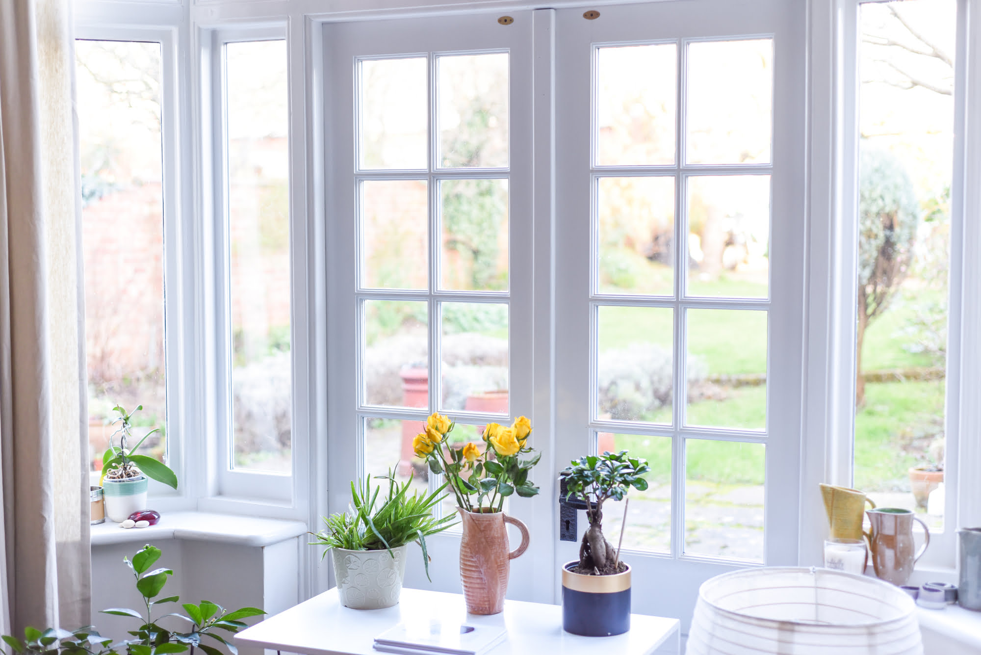 Stylish room interior with french doors and light neutral colour