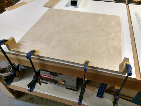 cabinet shelf clamped to work bench