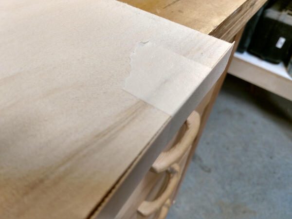 veneer edge banding taped to shelf